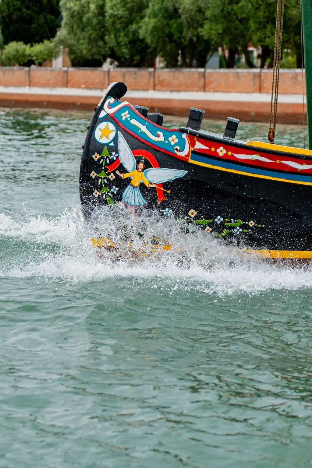 Close-up of the bow from Stella, a classic 1965 Bragozzo boat, steaming along.